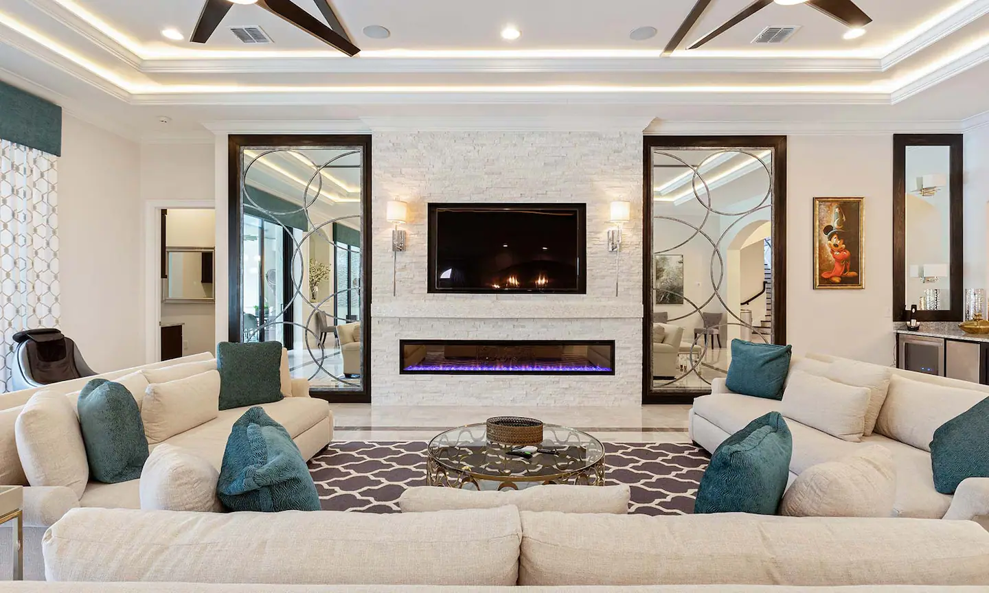 The living room has a fireplace and TV for family time and enjoyment.
