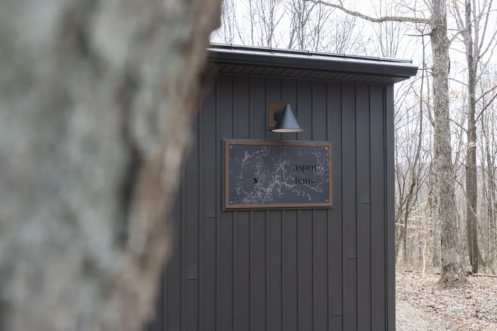 The Aspen Haus sign outside the house.