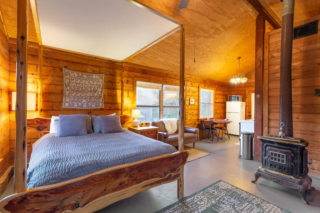 A queen-sized mattress built in canopy bed.