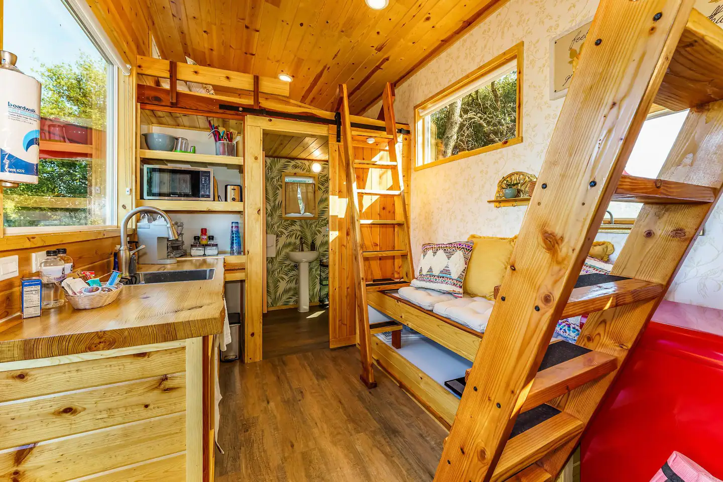 View from the living room of the bathroom and the second loft with the twin bed.
