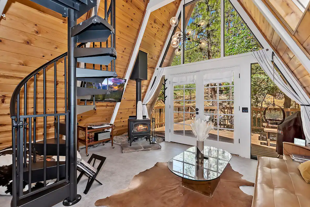 Smart TV and wood-burning fireplace in the living room