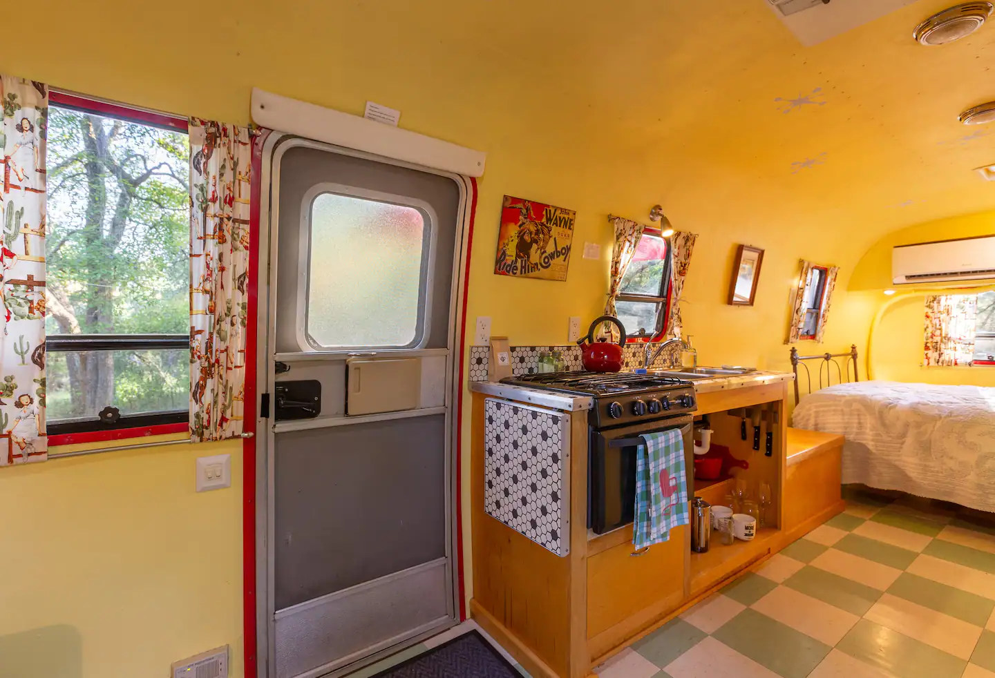 The Airstream kitchen is equipped with an RV-sized stove, a French press coffee machine, a bag of coffee from our local roaster, a fold out counter extension, a tea kettle, and basic cookware.