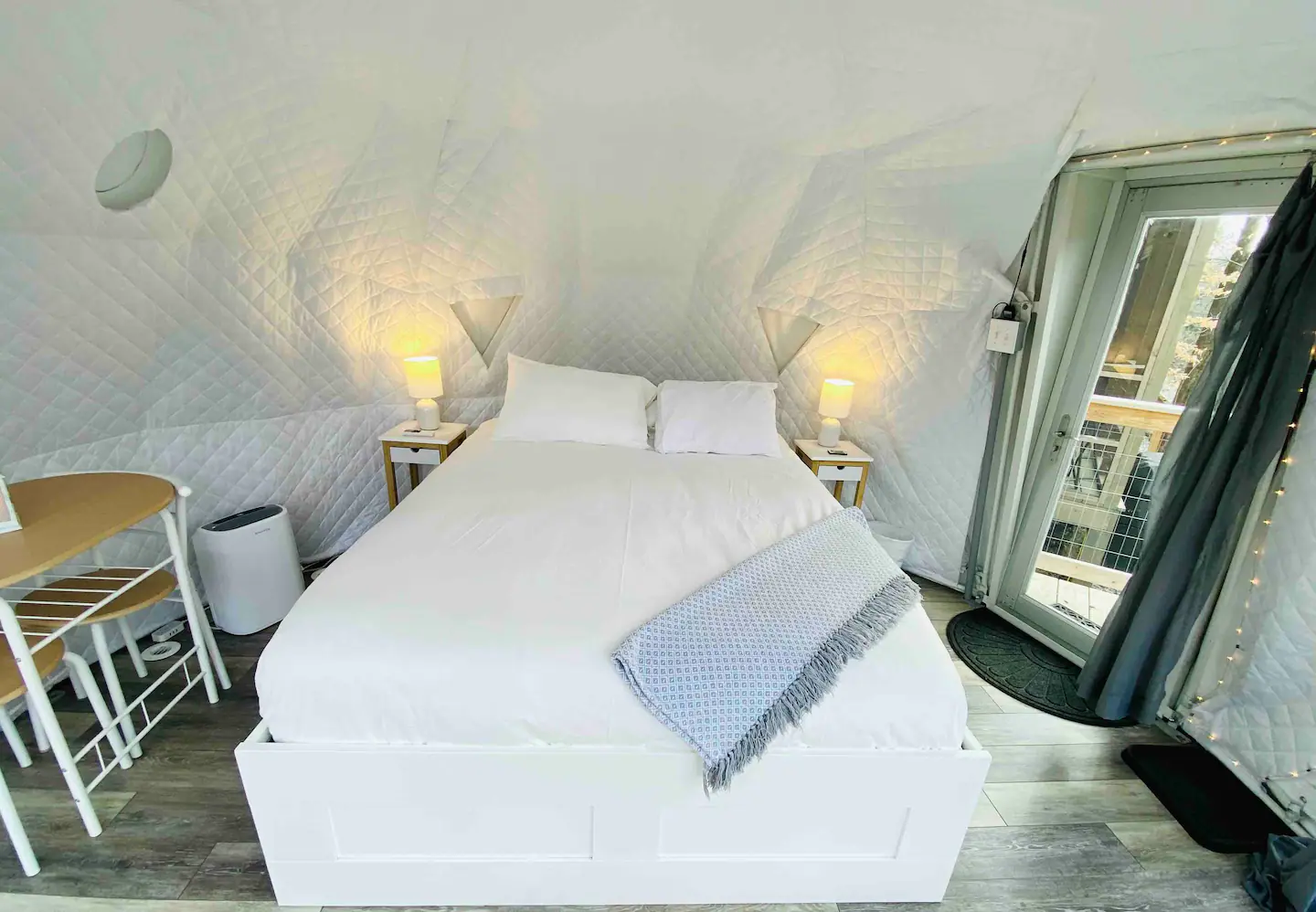 Sleep peacefully in the queen-sized bed, which features cotton linens and plush blankets/pillows.