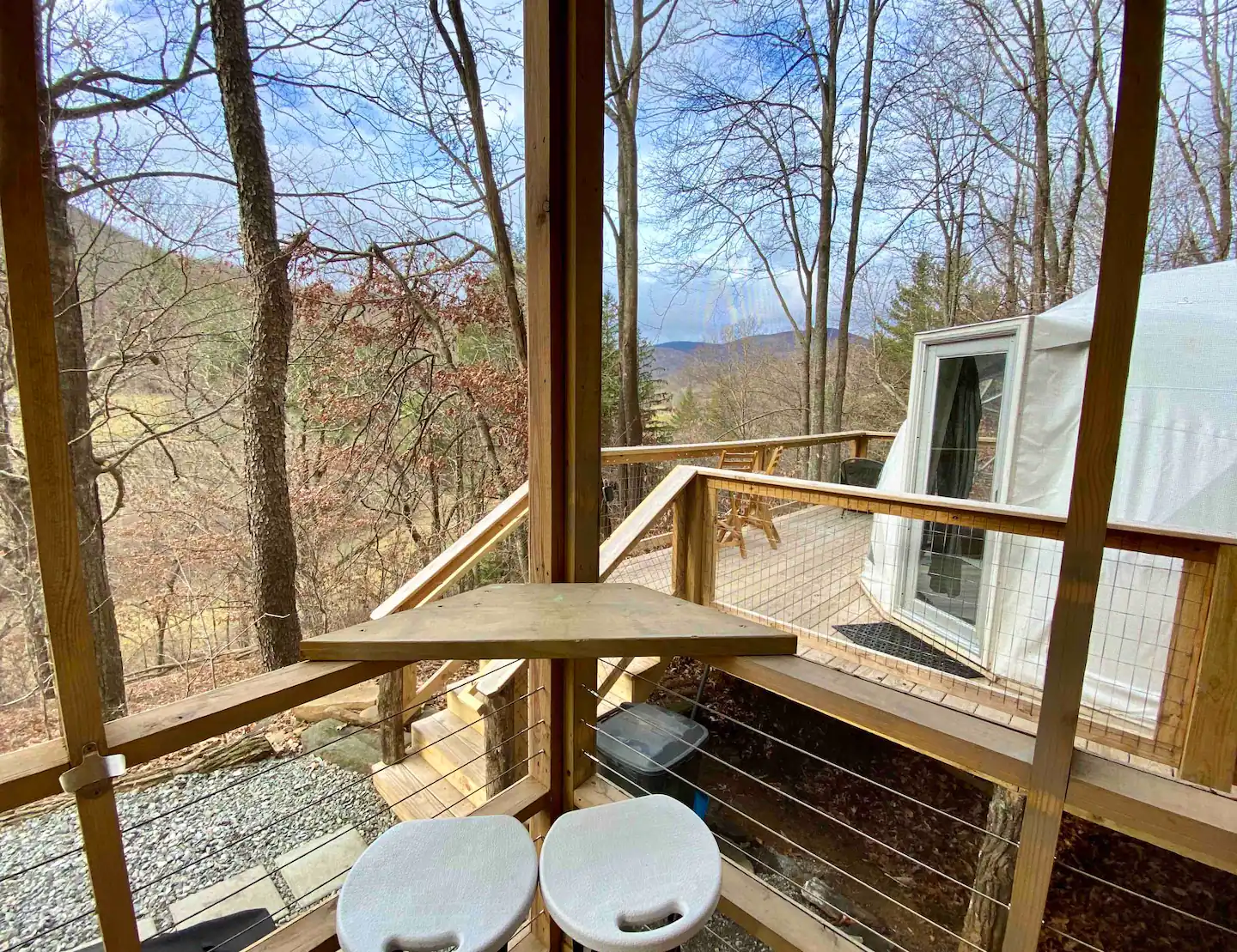 To enjoy your morning coffee, there is a perfect eating nook in the covered/screened-in kitchen area.