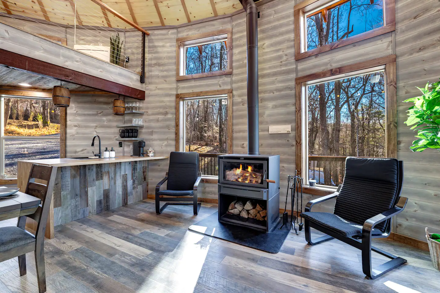 There are two rocking rockers and a wood stove.