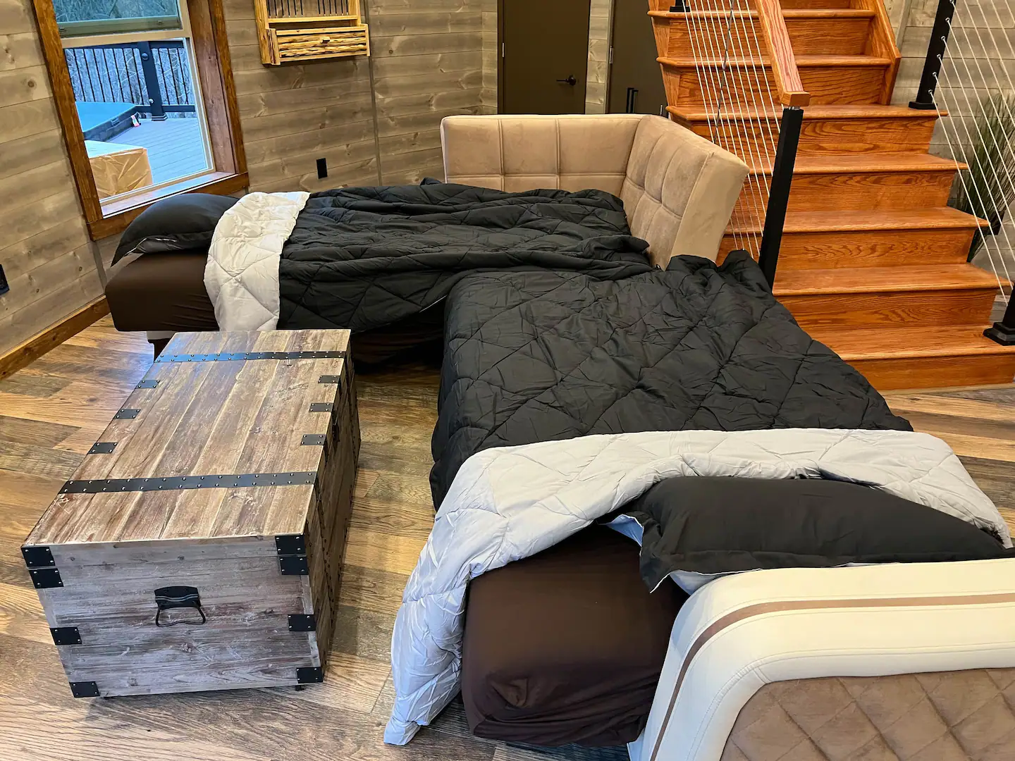 The sofa in the living room converts into two half-separate beds.