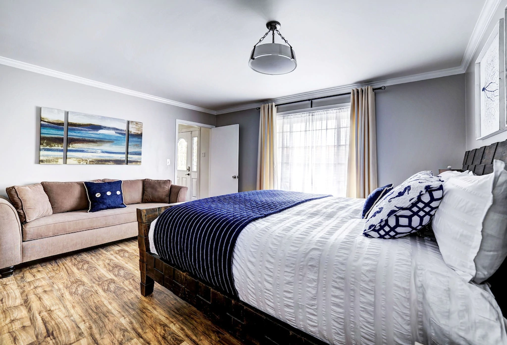 Cal King "Malibu" basement bedroom with bathroom and daybed sofa