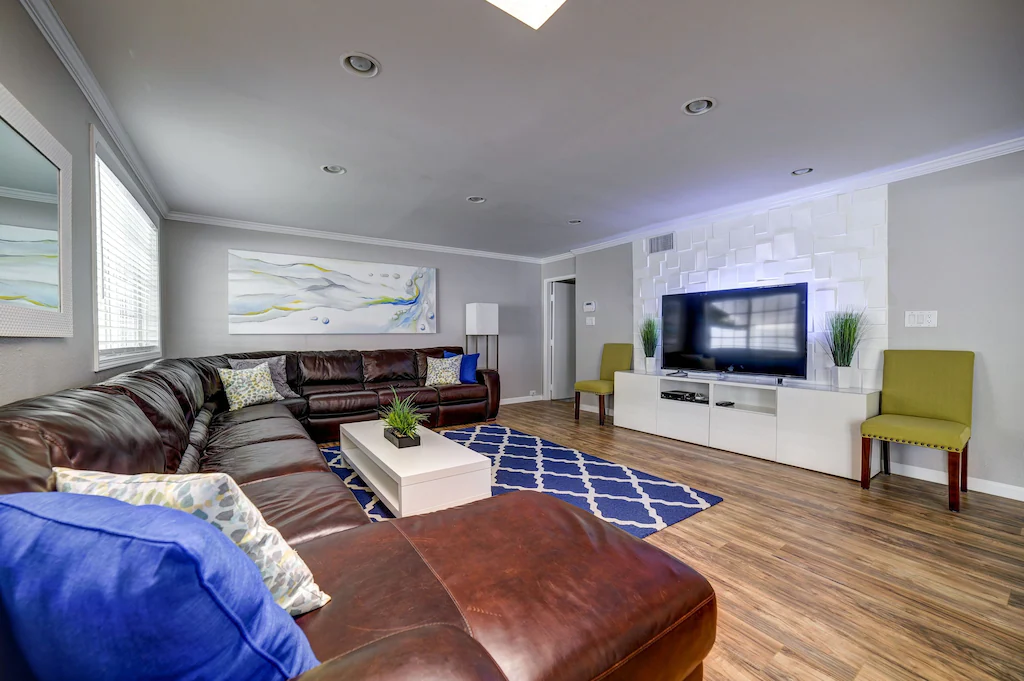 16' x 13' leather sectional with 65" TV
