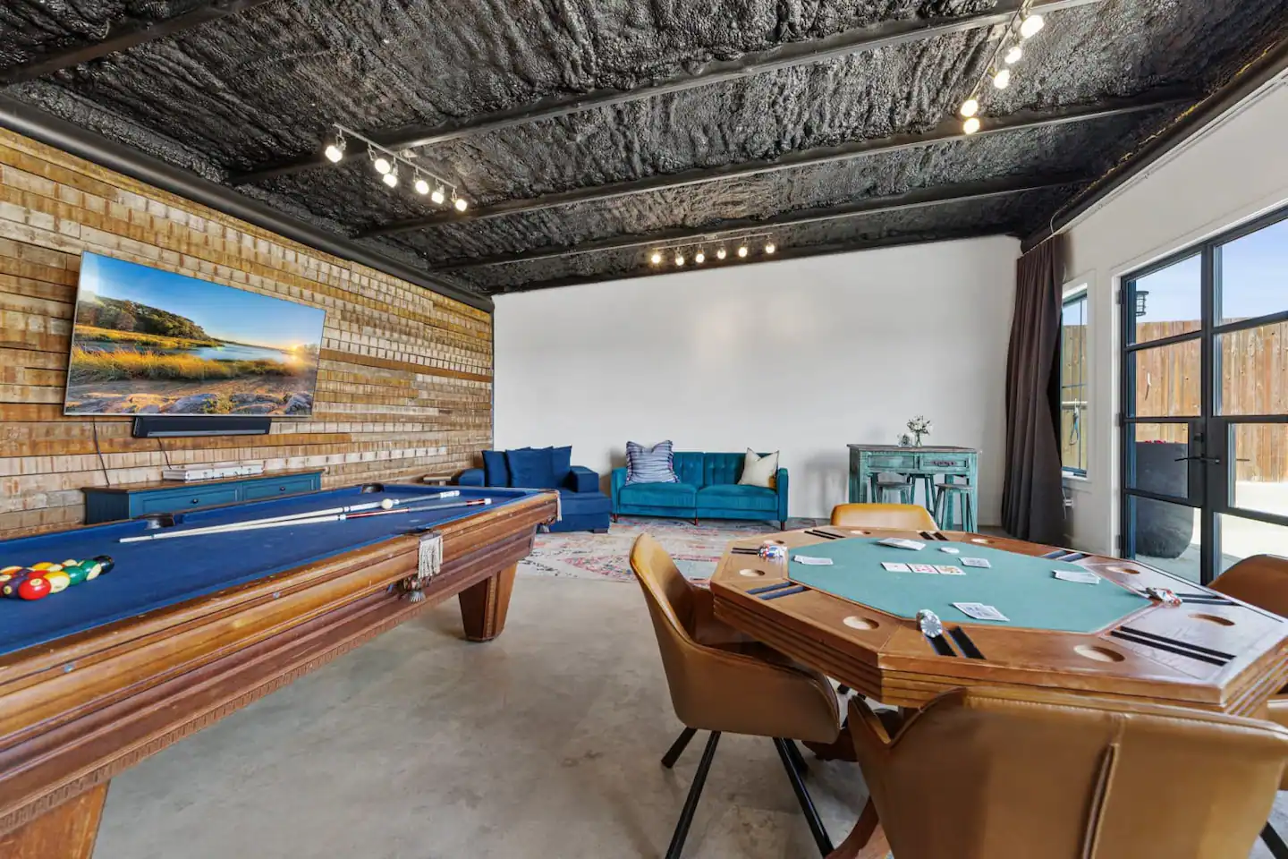 The Pool House is equipped with a poker table that can be converted into a different type of table if needed.