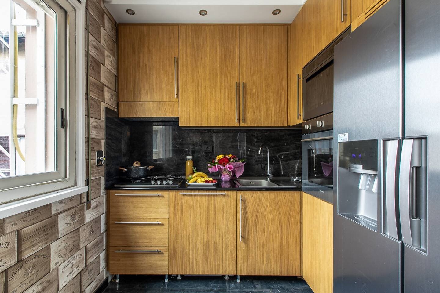 A spacious and modern full kitchen with stainless steel appliances, granite countertops, and ample cabinet space, ready for cooking and entertaining.