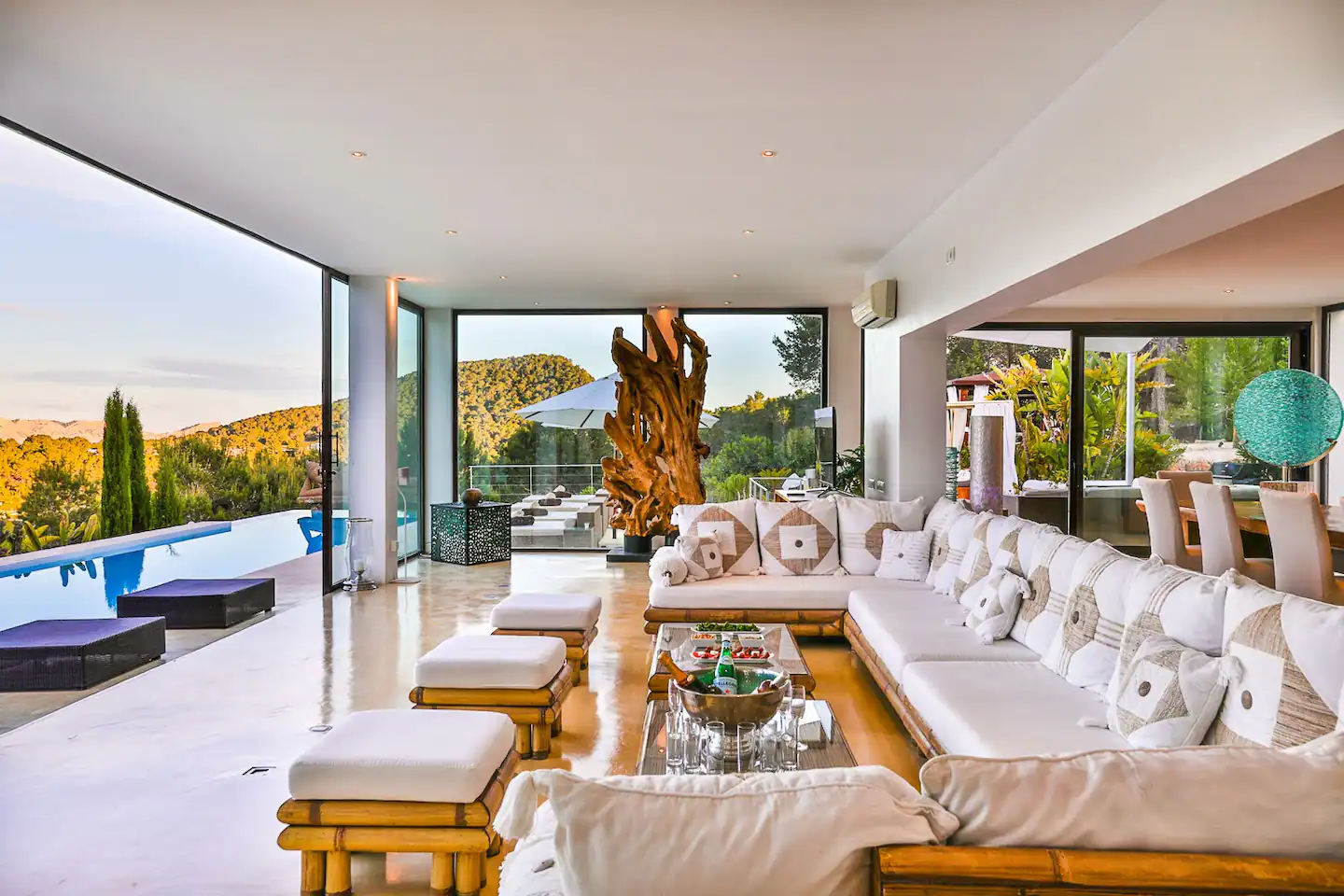 A generously sized living room with stylish modern furniture, large windows, and plenty of natural light.