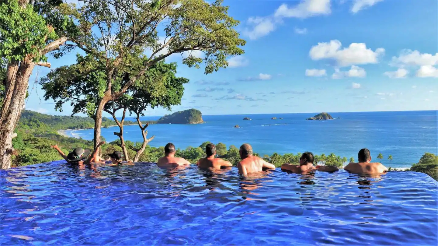 Enjoy the infinity-edge pool with a tropical drink in paradise.