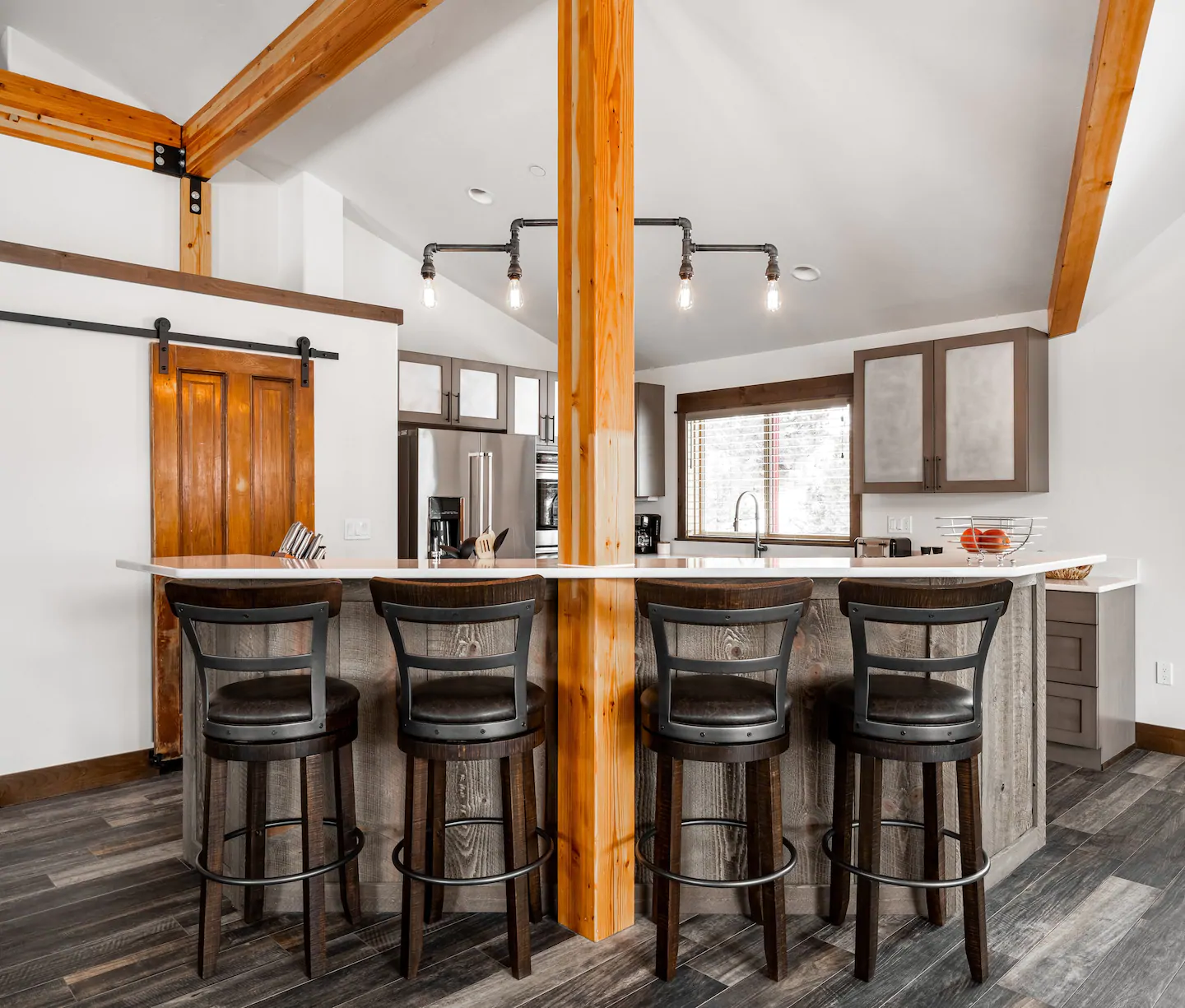 The large bar is perfect for gathering with friends and family, and the comfortable chairs make it easy to sit back and enjoy a meal.