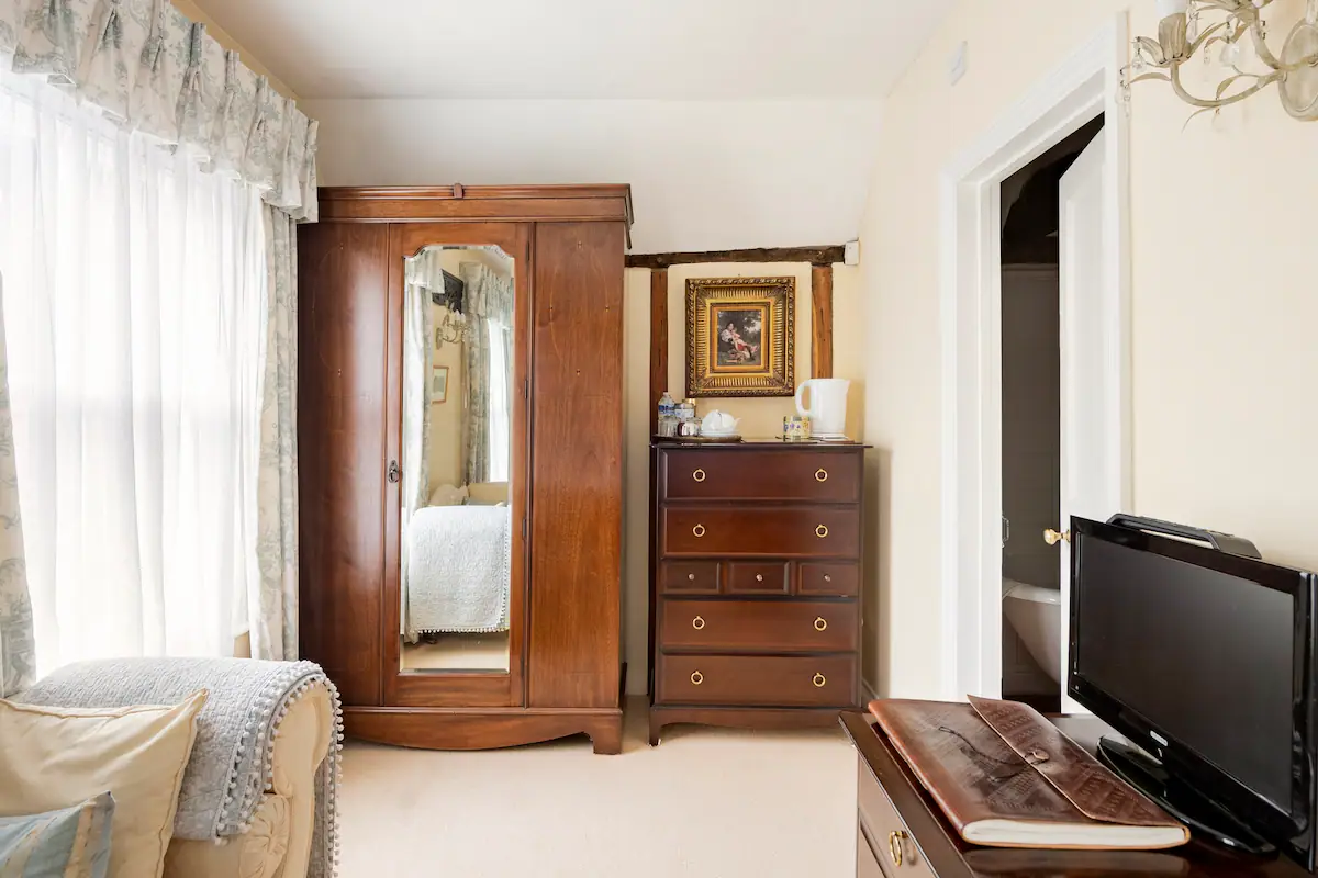 The spacious inlaid wardrobe with fluffy dressing gowns.