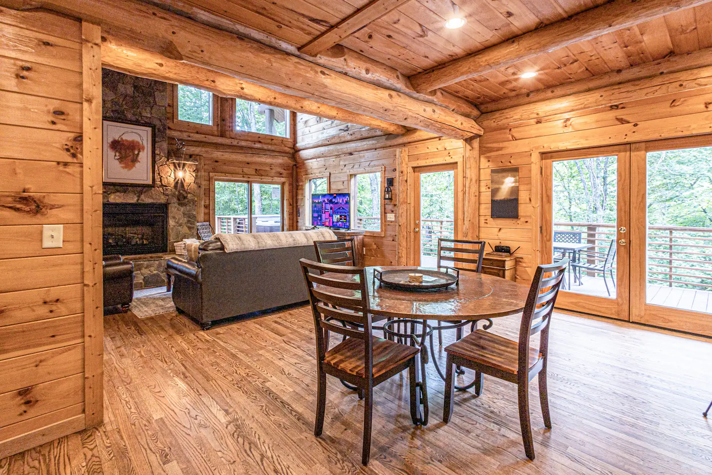 The dining area opens through French patio doors out to a covered deck.