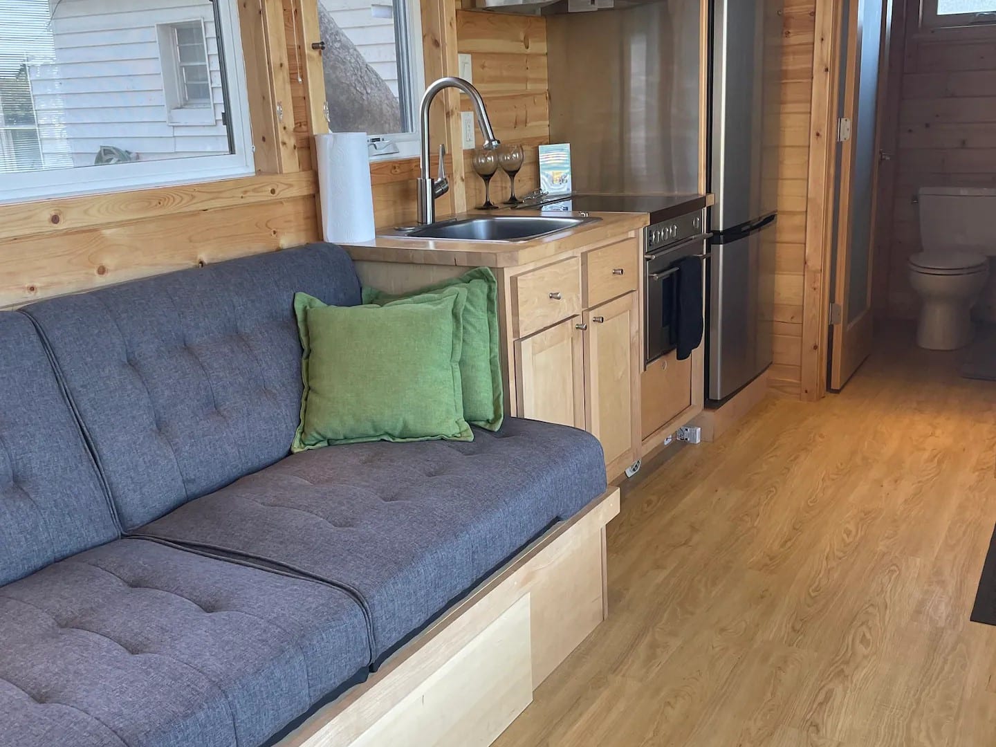 On the other side of the house there's a loft with another queen size bed upstairs.