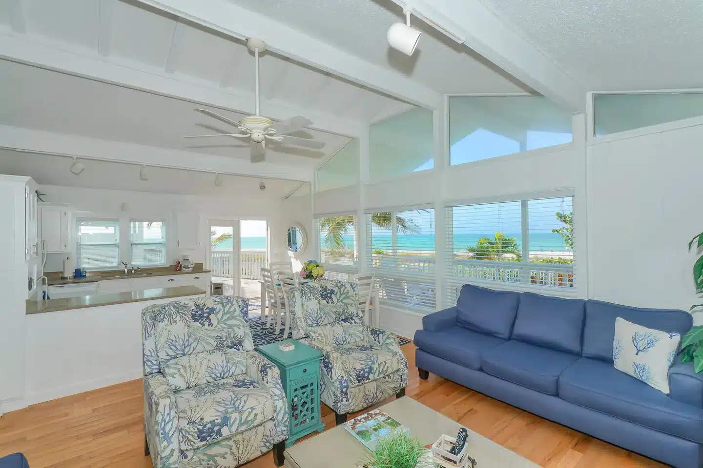 Comfortable living area with 2 three seater sofas and 2 armchairs.