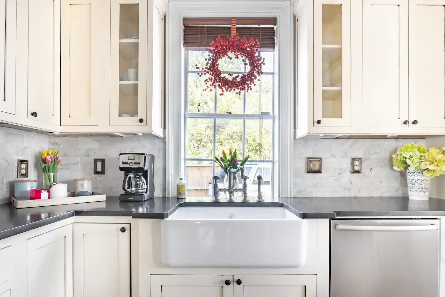 The newly renovated kitchen comes equipped with a gas stove, stainless steel appliances, coffee maker, and additional wet bar with mini fridge and ice maker.