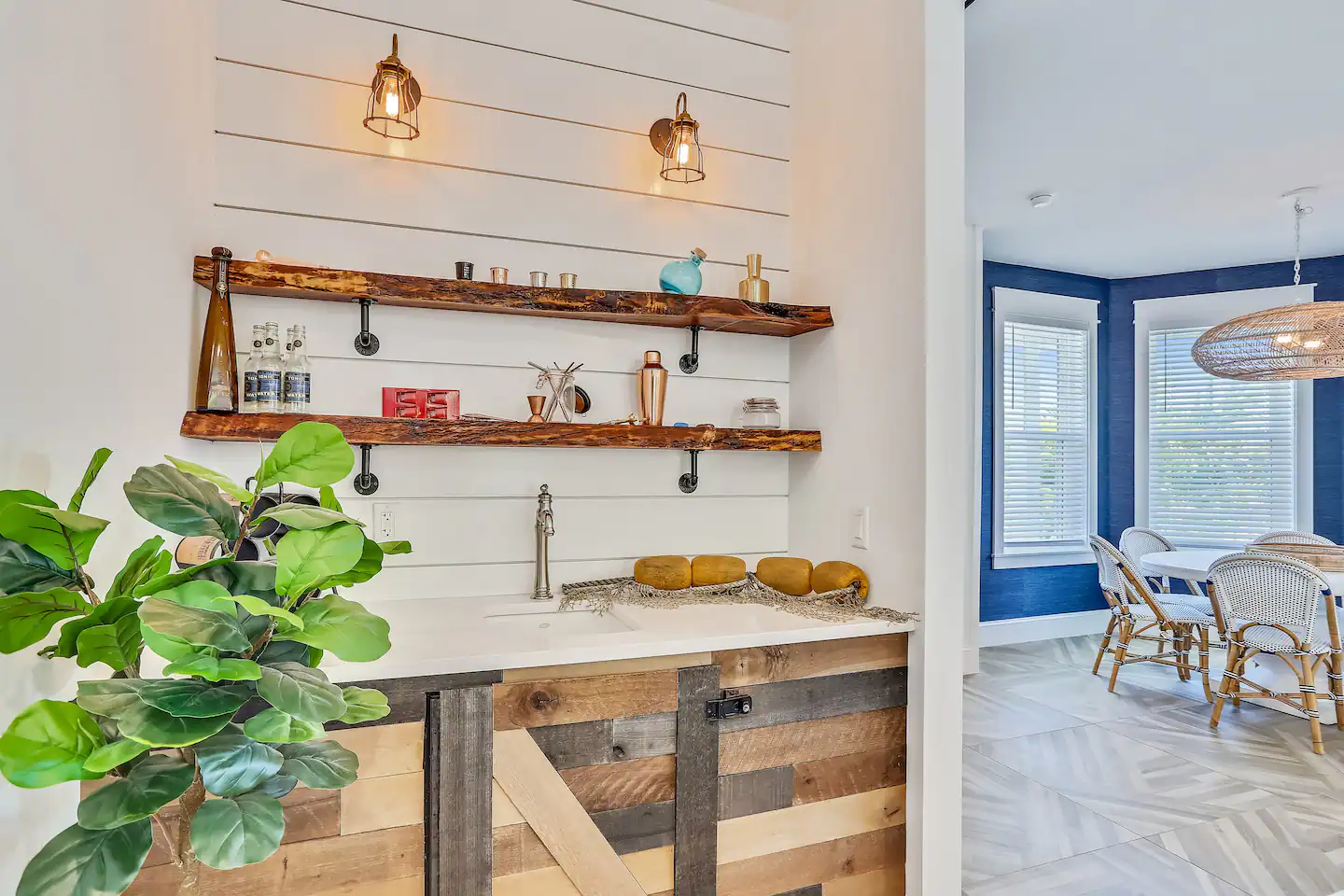 Swim-up bar with a wet bar and a wine fridge