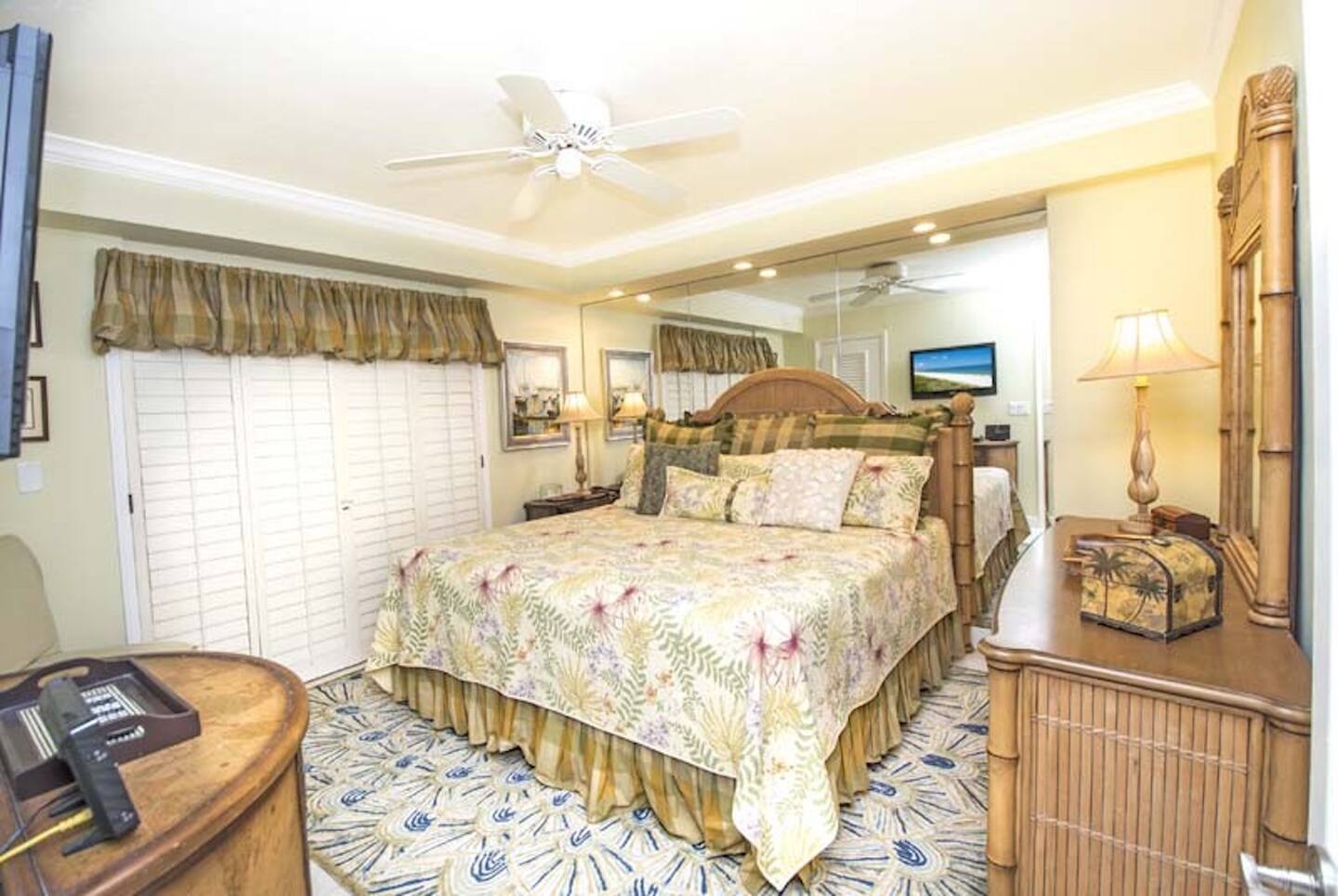 2nd master bedroom with king bed. Lots of storage with dresser and closet. Room has a TV.