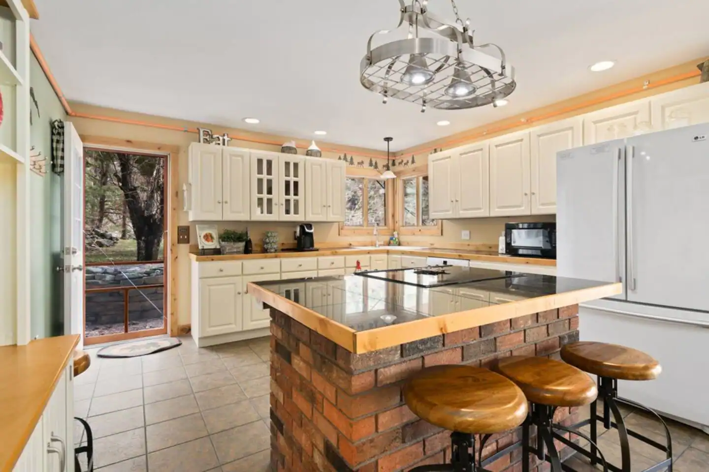Plenty of Cabinet Space and Views out the Kitchen.