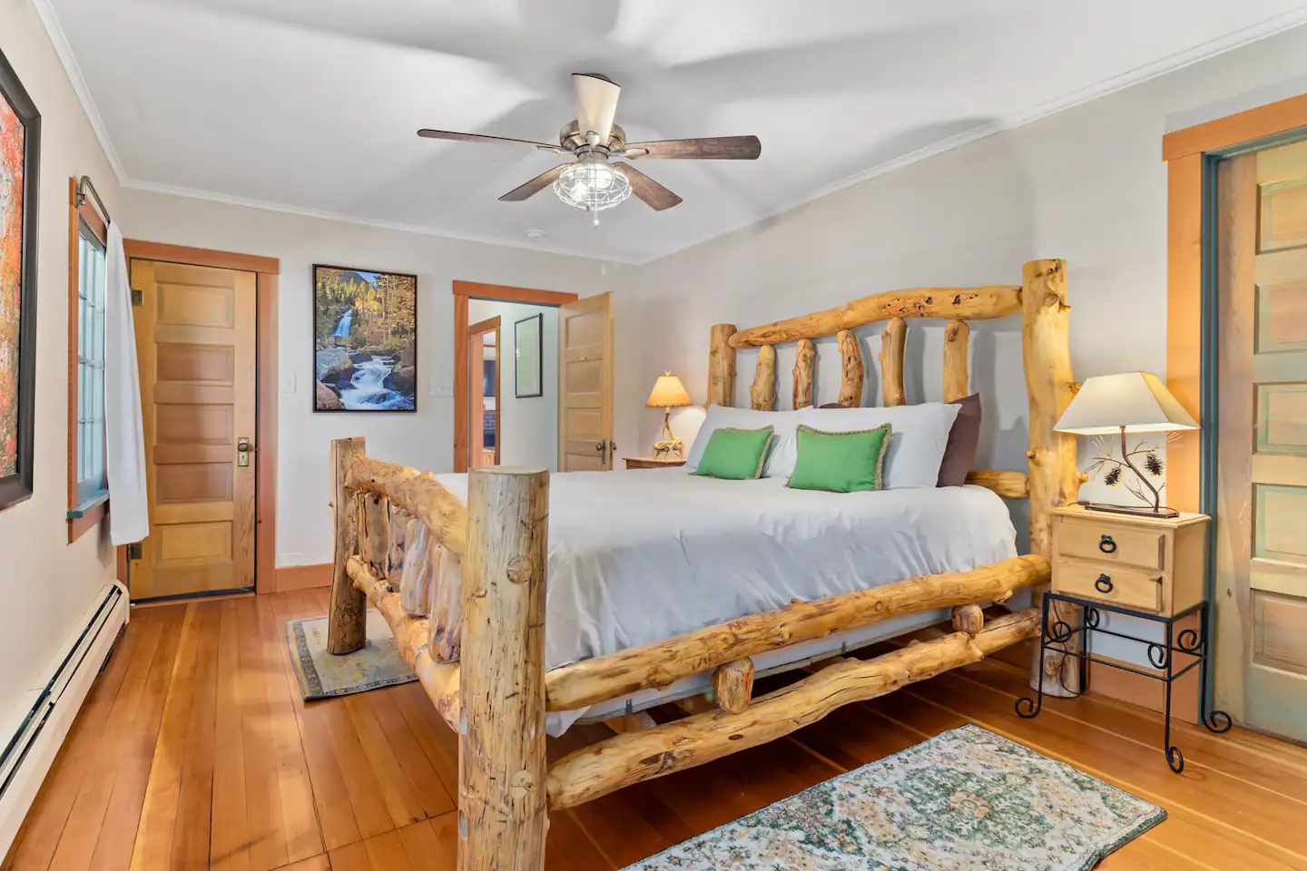 One level lodging includes a king-size aspen log bed and queen sized bed with fresh white duvet covers and linens.