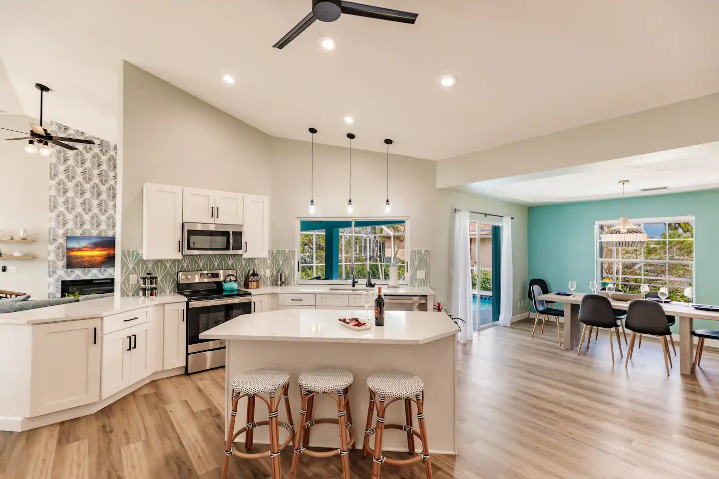 Gorgeous open chef's kitchen with a huge island for prep service and entertaining, and views of the stunning pool.