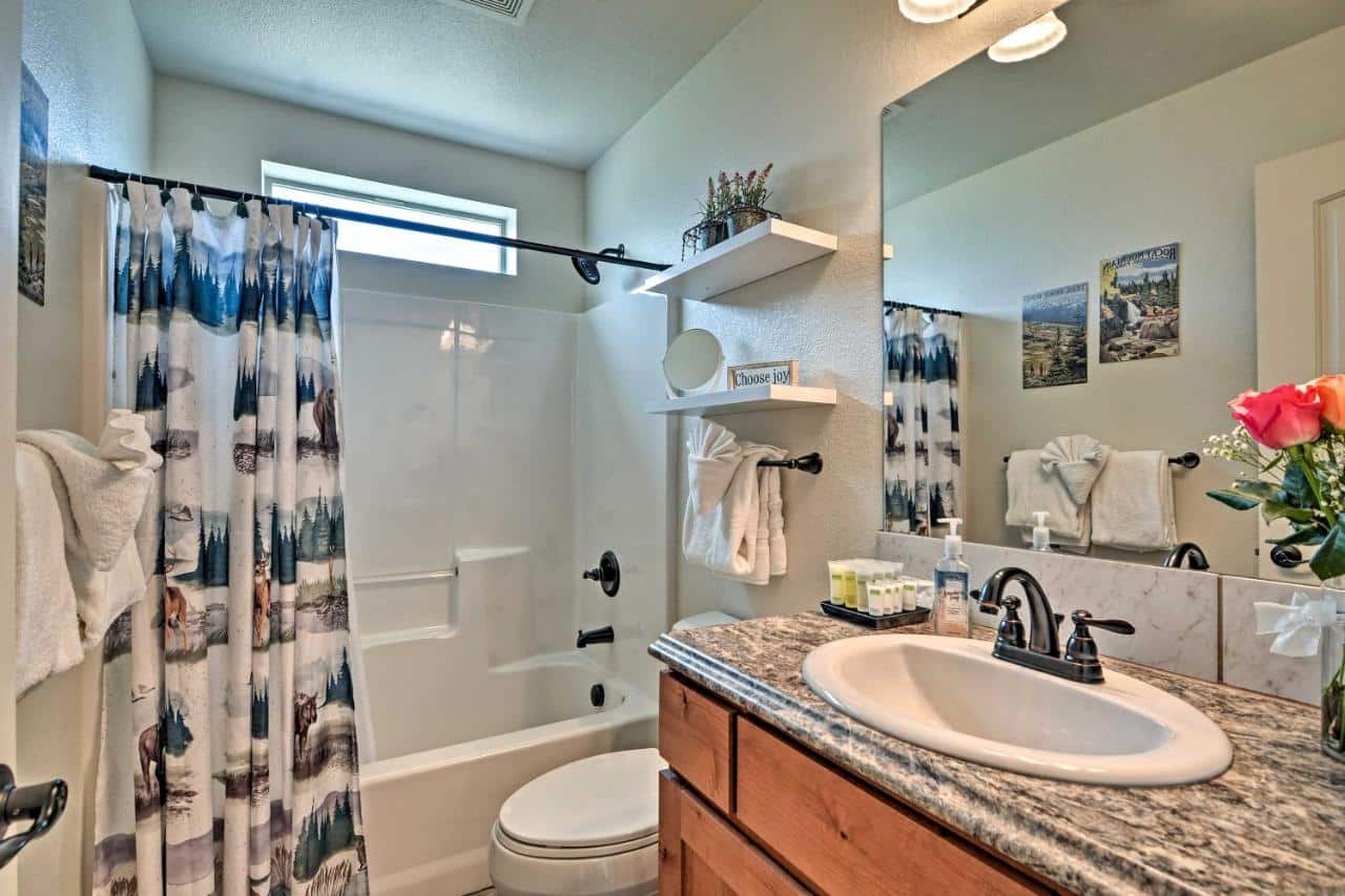 Bathroom next to other bedroom.