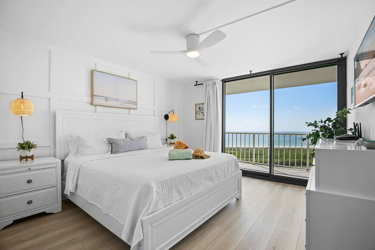 Soothing and coastal inspired primary bedroom with comfy king bed.