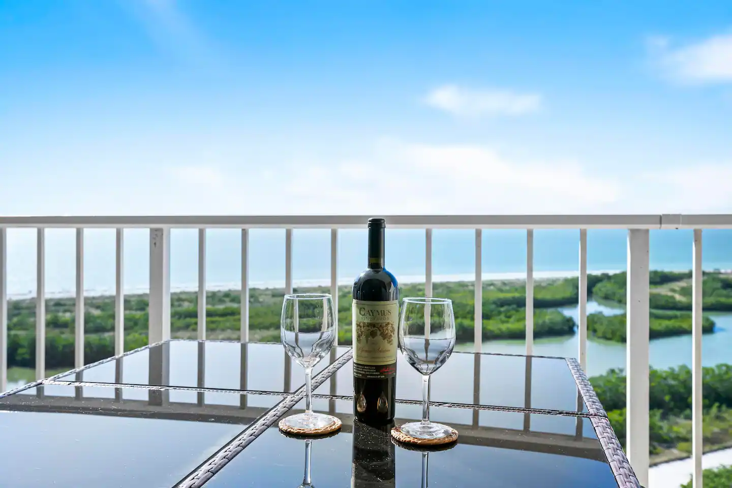 Enjoy a glass of wine, morning coffee or a meal overlooking the Gulf on the 25' balcony. Balcony seats six.