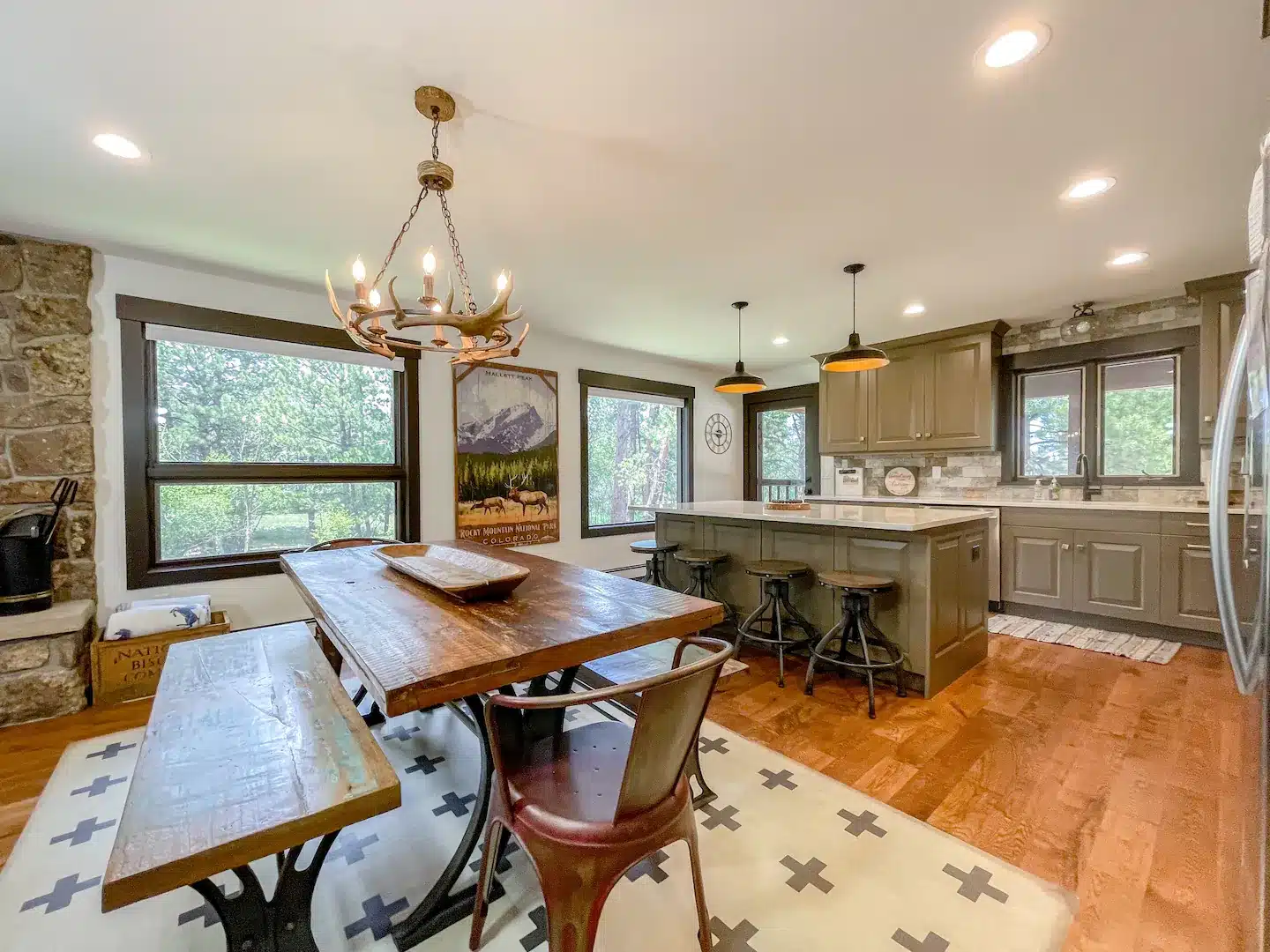 The custom kitchen is inviting with beautiful cabinetry, solid surface countertops, stainless steel appliances and a complete selection of cookware and dishes to prepare and serve a gourmet meal.