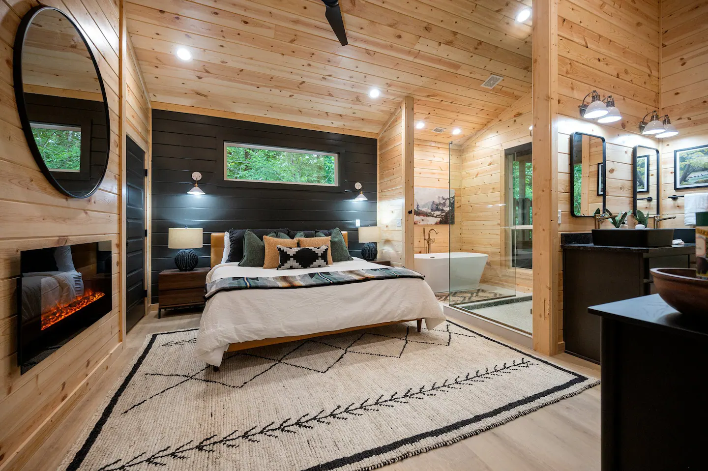 The bedroom features an amazing King-sized bed, with comfortable pillows/sheets, a visual fireplace, an amazing SPA bathroom and a mounted Roku TV that offers complimentary access to Netflix.