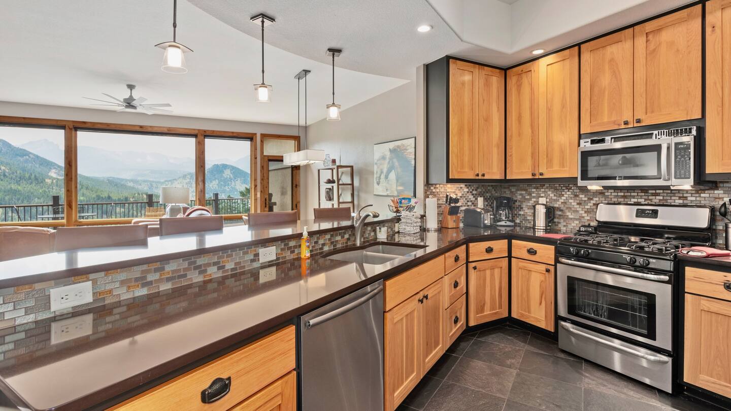 The kitchen at Serenity is a chef's delight and is equipped with top-of-the-line appliances alongside those same amazing views.