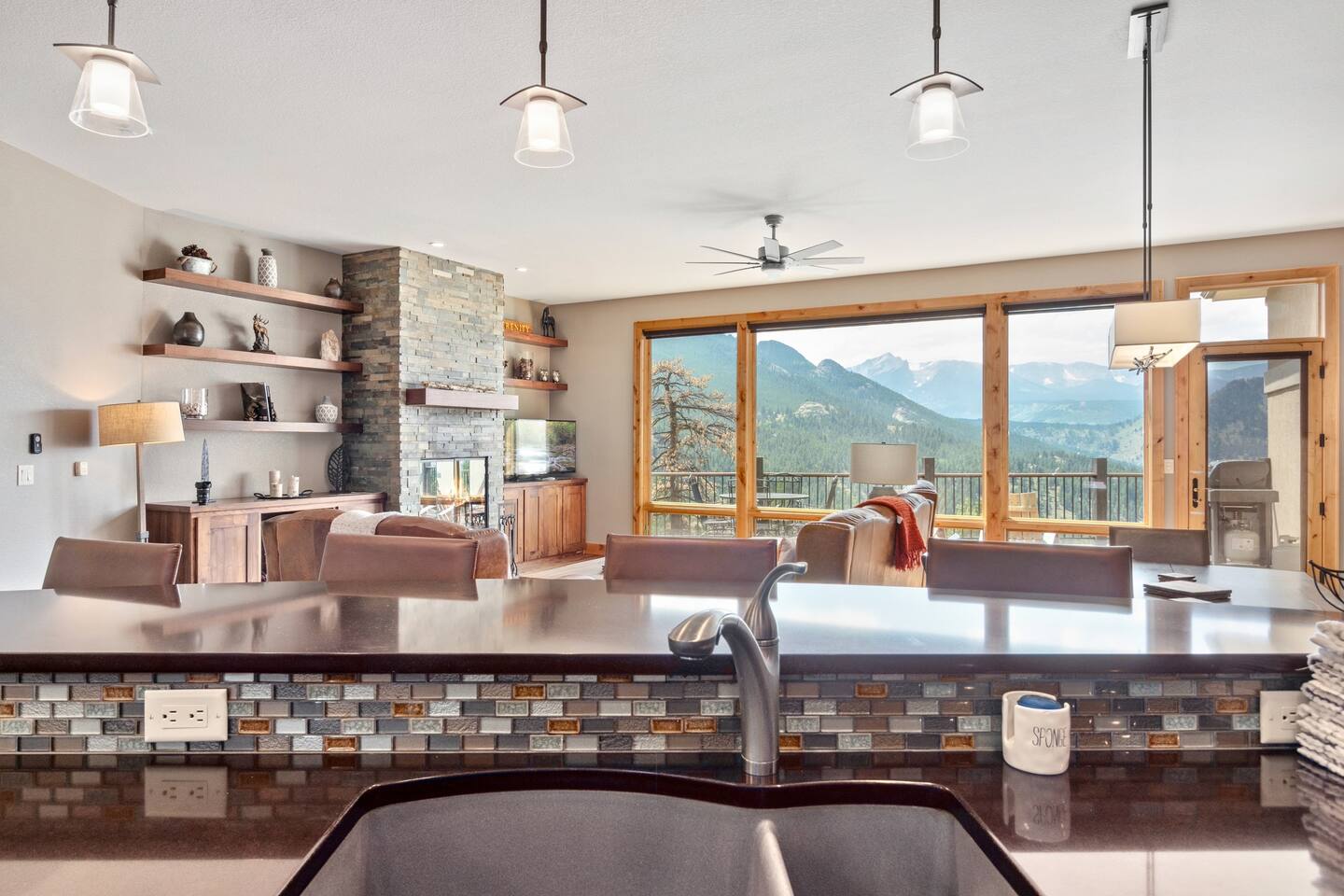 You'll be captivated by the unique, two-tone cabinetry that lends this fine kitchen a sense of being both modern and perfectly in sync with the home's natural setting.