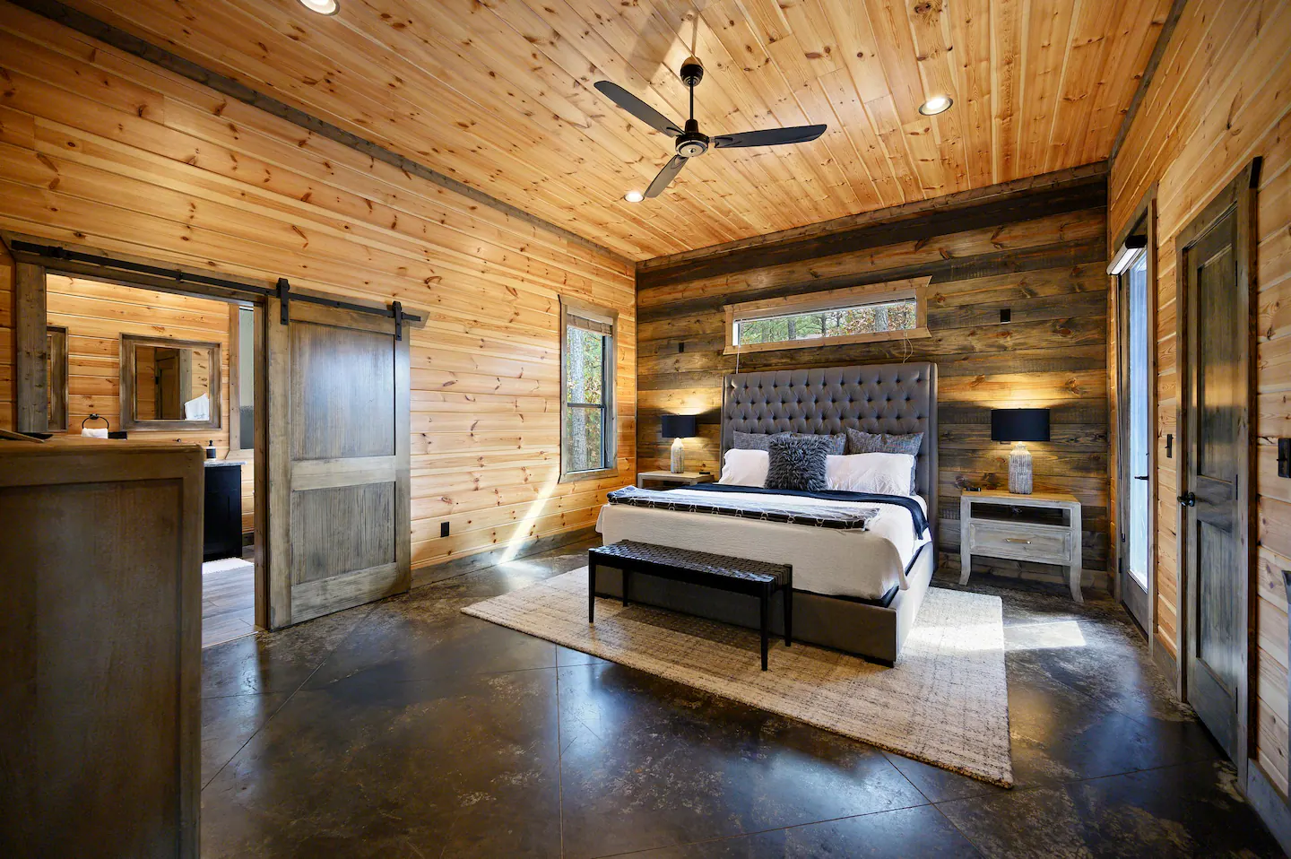 Quiet and polished, this master bedroom has its own private balcony to relax on away from other guests!