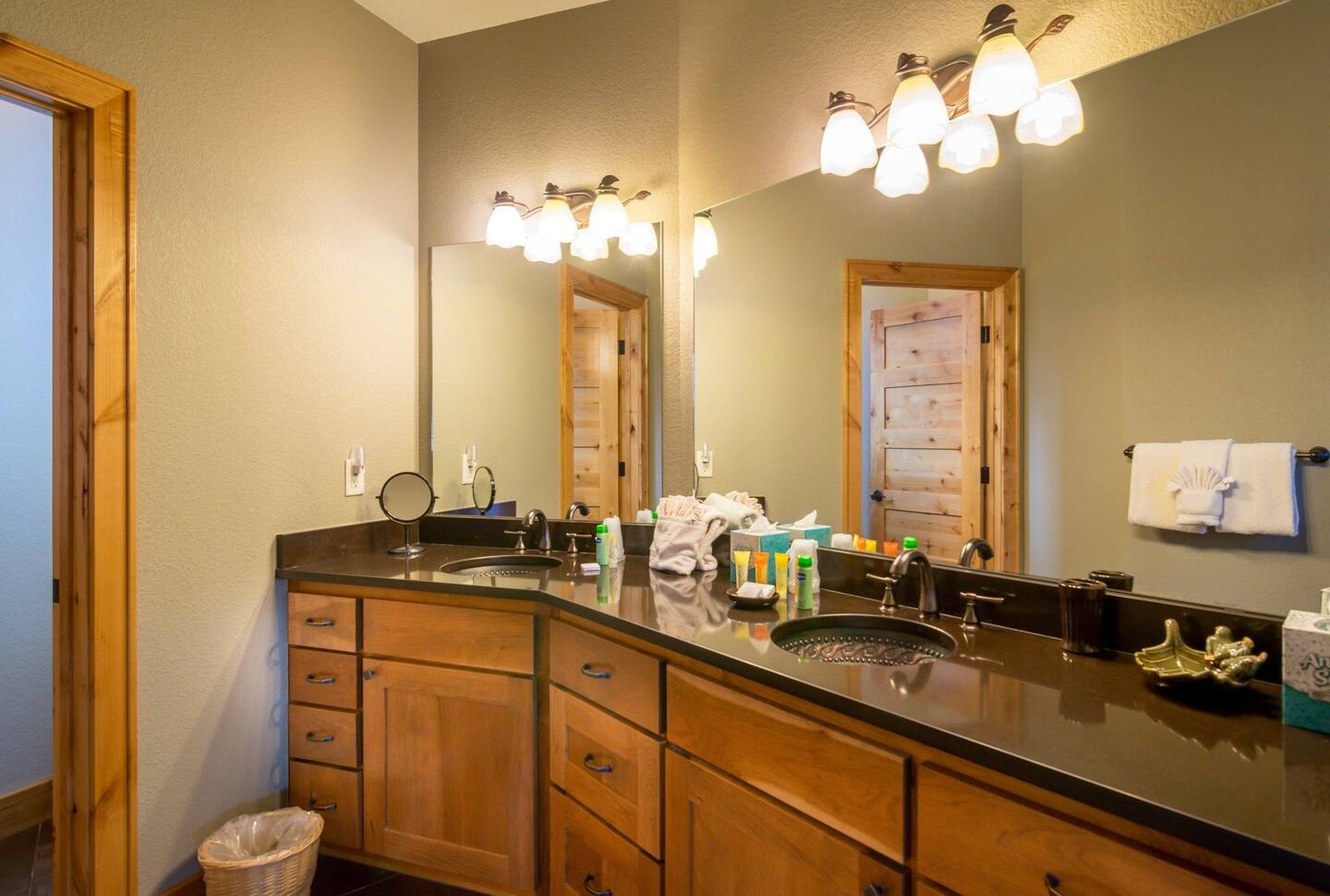 Bathroom with its large soaking tub and etched-glass shower enclosure.