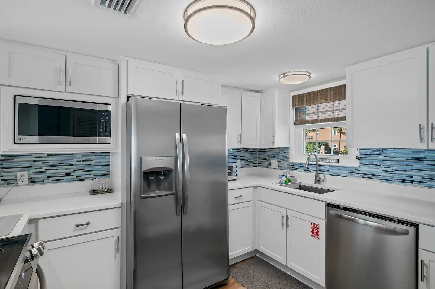 A fully stocked kitchen with stainless steel appliances and a coffee pot that can make a pot of coffee or a Keurig single cup.