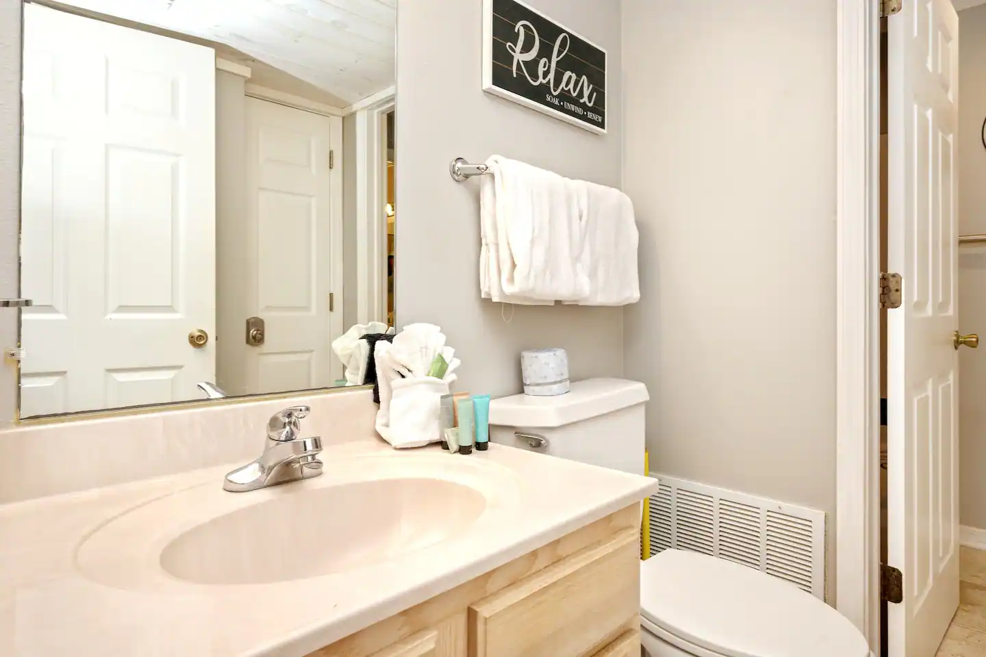 Our one and half "Jack & Jill style" bathroom offers a separate toilet & vanity area for both the master bedroom, and the hallway.